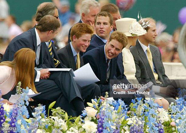 Princess Beatrice, Prince Andrew, Prince Charles, Prince Harry, Prince William and Peter Phillips sit with Prince Edward his wife Sophie during...