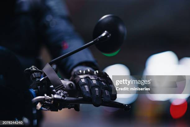 close up shot of a motorcyclist’s hand on the brake - inzoomen stockfoto's en -beelden