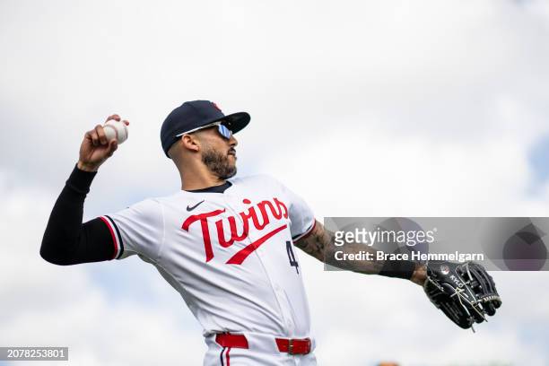 Carlos Correa of the Minnesota Twins throws prior to a spring training game against the Tampa Bay Rays on March 3, 2024 at the Lee County Sports...