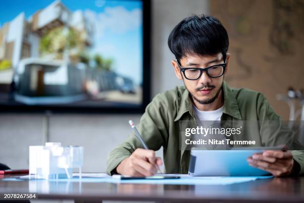 error reduction and quality improvement with bim technology in your construction project. a designer on construction project design review via design software to check errors in their projects in a design office space. - construction mistake stock pictures, royalty-free photos & images