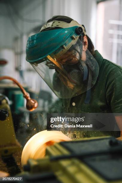 Artisan Julie Jackson is photographed for Los Angeles Times on April 5, 2023 in Los Angeles, California. Jackson turns a bowl from valley oak on a...