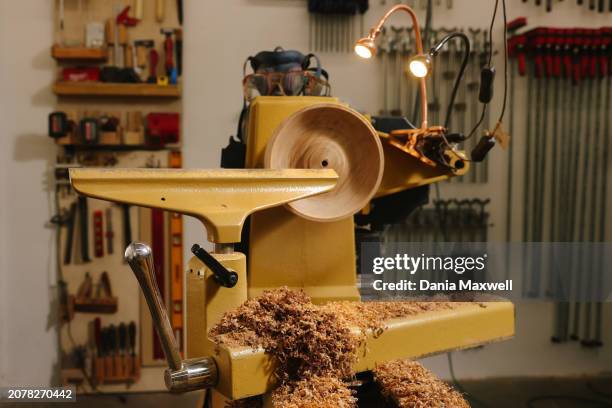 Turned bowl rests on the lathe of artisan Julie Jackson's workstation is photographed for Los Angeles Times on April 5, 2023 in Los Angeles,...
