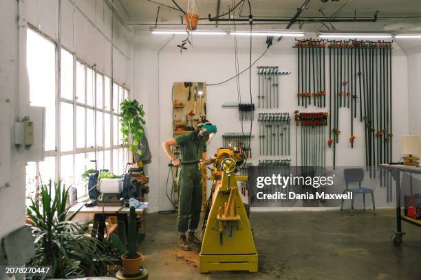 Artisan Julie Jackson is photographed for Los Angeles Times on April 5, 2023 in Los Angeles, California. Jackson turns a vase. Jackson's pieces are...