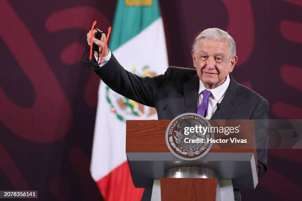 President of Mexico Andres Manuel Lopez Obrador shows a slingshot, stones and pellets allegedly used by the students of Ayotzinapa in the protest...