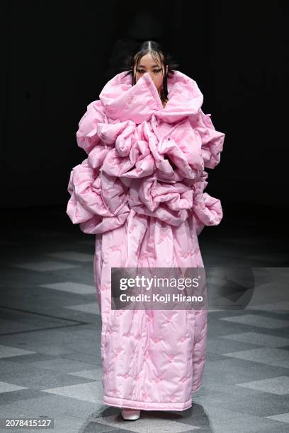 Model walks the runway in a design by HOUGA during the Rakuten Fashion Week TOKYO 2024 A/W on March 12, 2024 in Tokyo, Japan.