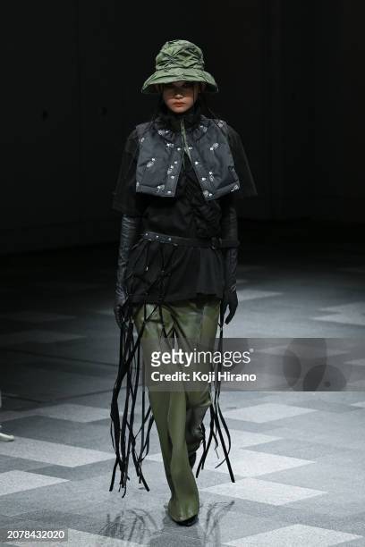 Model walks the runway in a design by HOUGA during the Rakuten Fashion Week TOKYO 2024 A/W on March 12, 2024 in Tokyo, Japan.