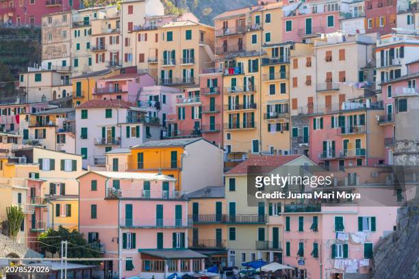 manarola small town, in the province of la spezia(liguria, northern italy) on the ligurian sea.  it is part of cinque terre named world heritage site. - ligurian sea stock pictures, royalty-free photos & images
