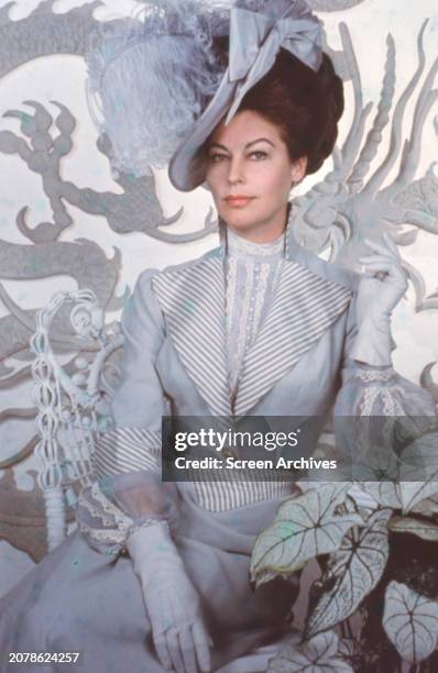 Ava Gardner wearing period costume and hat from the 1963 movie '55 Days at Peking'.