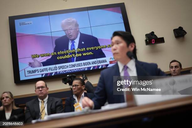 Former special counsel Robert K. Hur testifies in front of a video of former President Donald Trump during a hearing held by the House Judiciary...