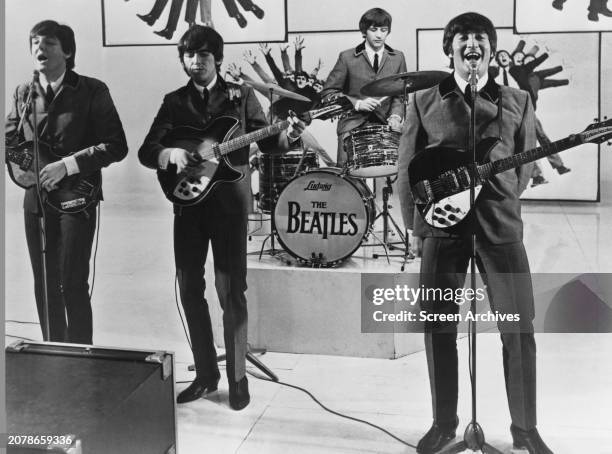 The Beatles' John Lennon, Paul McCartney, Ringo Starr and George Harrison perform from their 1964 film 'A Hard Day's Night' .
