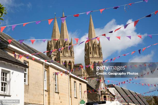Spires of cathedral rise above historic town center buildings, Truro, Cornwall, England, UK.