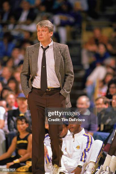 Head coach Don Nelson of the Golden State Warriors walks on the sidelines during an NBA game in the 1989-90 season. NOTE TO USER: User expressly...