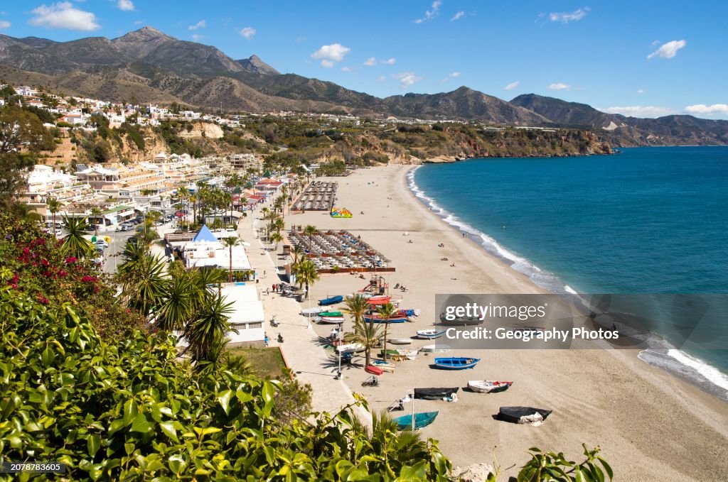 Playa Burriana sandy beach at popular holiday resort town of Nerja, Malaga province, Spain