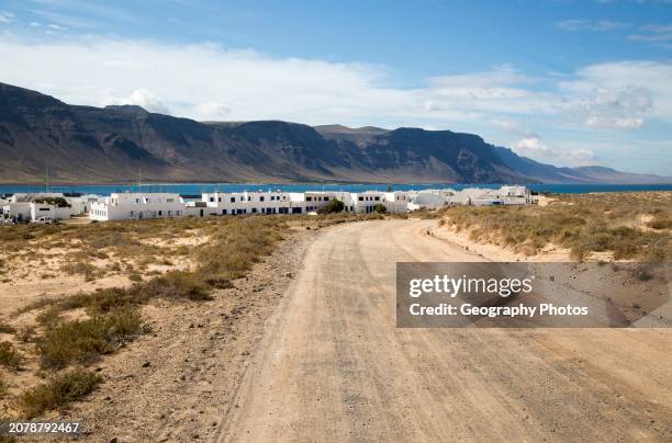 Dirt track leading to Caleta de Sebo village on Graciosa island, Lanzarote, Canary Islands, Spain.