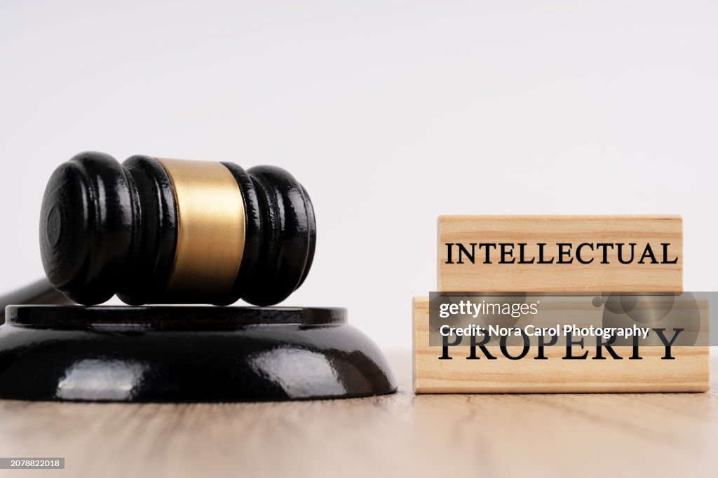 Gavel and Block and Intellectual Property Text on Wood Block
