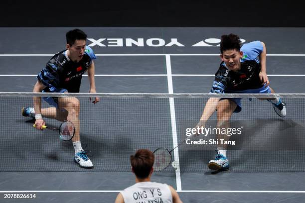 Liu Yuchen and Ou Xuanyi of China compete in the Men's Doubles first Round match against Ong Yew Sin and Teo Ee Yi of Malaysia during day one of the...