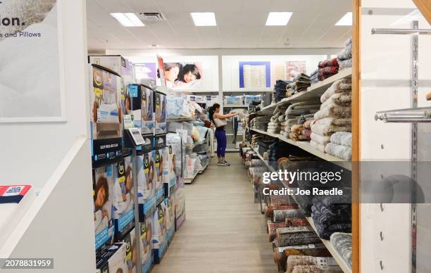 Person shops in a Kohl's department store on March 12, 2024 in Miami, Florida. Shares of Kohl's fell as it posted a drop in same-store sales in the...