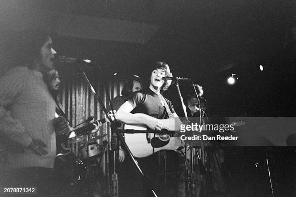Singer songwriter Rodney Crowell performs on stage at the Cal State Long Beach State University coffee house in late 1975 including singer Nicolette...