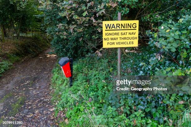 Sign warning ignore Sat Nav no through way for vehicles, Melton, Suffolk, England, UK.