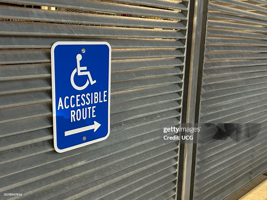 Handicapped Accessible Route sign on wall, Queens, New York