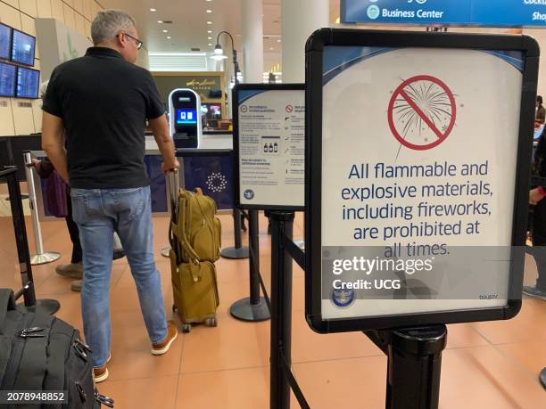 Warning sign at Airport terminal, All flammable and explosive materials including fireworks are prohibited, PBIA, Palm Beach International Airport,...