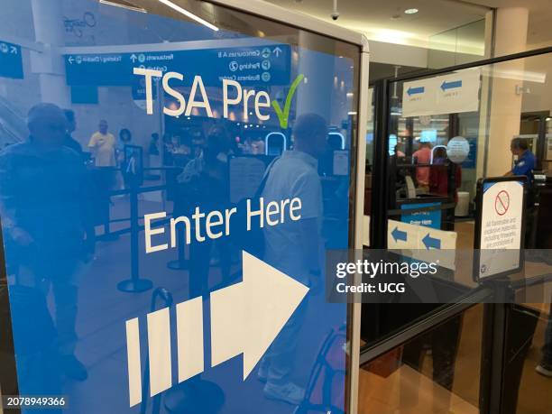 Pre Check enter here sign at airport transportation security administration area, Palm Beach International Airport, Florida.
