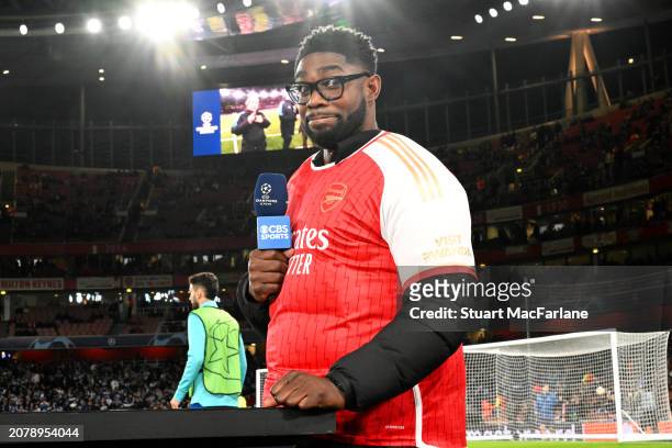 Micah Richards, former English football player and current TNT Sports pundit, wears an Arsenal shirt prior to the UEFA Champions League 2023/24 round...