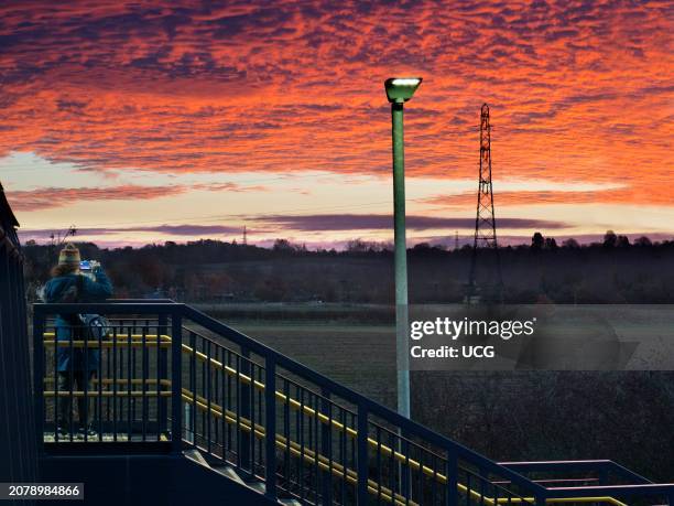 Photographing electricity pylons, street light and spectacular pre-dawn sky in Lower Radley at dawn.