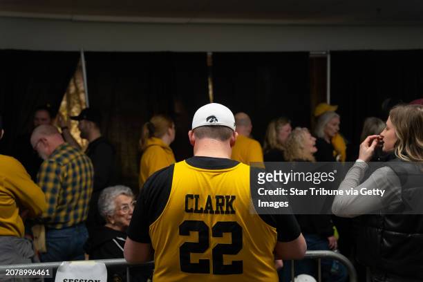 University of Iowa Hawkeyes and Caitlin Clark fans alike wait in line for a Women's Big Ten Basketball Tournament quarterfinals game between Iowa and...