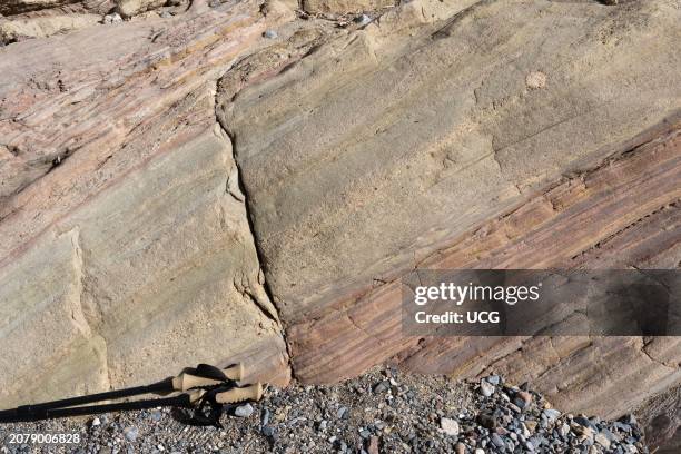 Tilted sandstone and laminated red siltstone. Miocene Furnace Creek Formation, Death Valley National Park, California.
