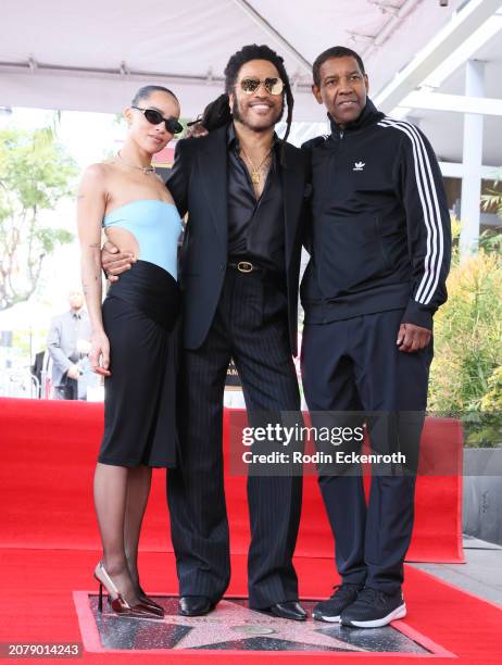 Zoë Kravitz and Denzel Washington pose with Lenny Kravitz during his Hollywood Walk of Fame Star Ceremony on March 12, 2024 in Hollywood, California.