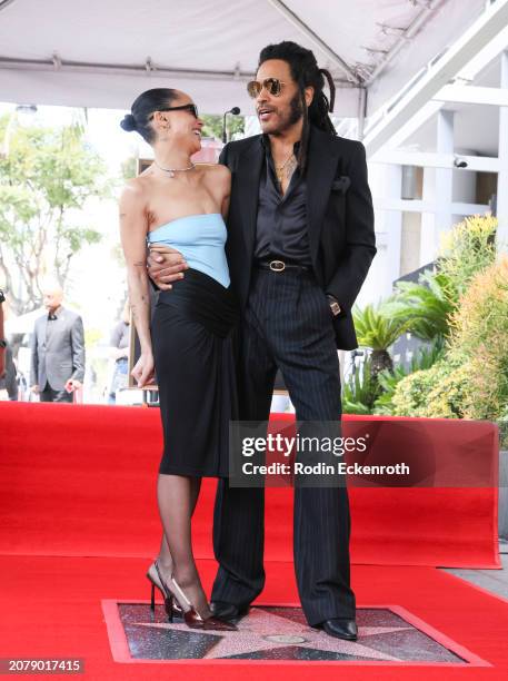 Zoë Kravitz poses with Lenny Kravitz during his Hollywood Walk of Fame Star Ceremony on March 12, 2024 in Hollywood, California.