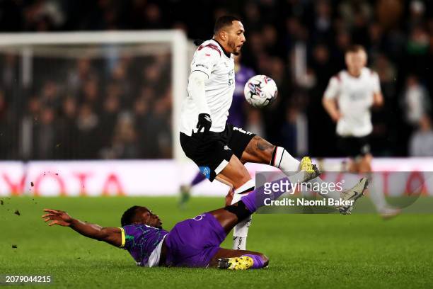 Nathaniel Mendez-Laing of Derby County is challenged by Andy Yiadom of Reading during the Sky Bet League One match between Derby County and Reading...