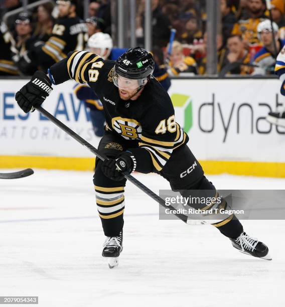 Matt Grzelcyk of the Boston Bruins skates against the St. Louis Blues during the second period at the TD Garden on March 11, 2024 in Boston,...