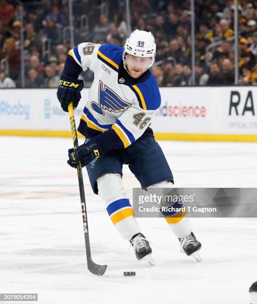 Scott Perunovich of the St. Louis Blues skates against the Boston Bruins during the second period at the TD Garden on March 11, 2024 in Boston,...