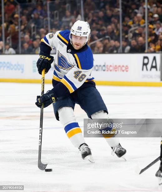 Scott Perunovich of the St. Louis Blues skates against the Boston Bruins during the second period at the TD Garden on March 11, 2024 in Boston,...