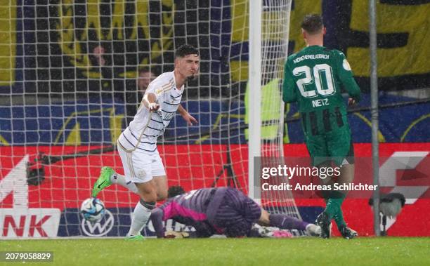 Mohamed Amine Naifi of 1. FC Saarbruecken celebrates scoring his team's first goal during the DFB cup quarterfinal match between 1. FC Saarbrücken...