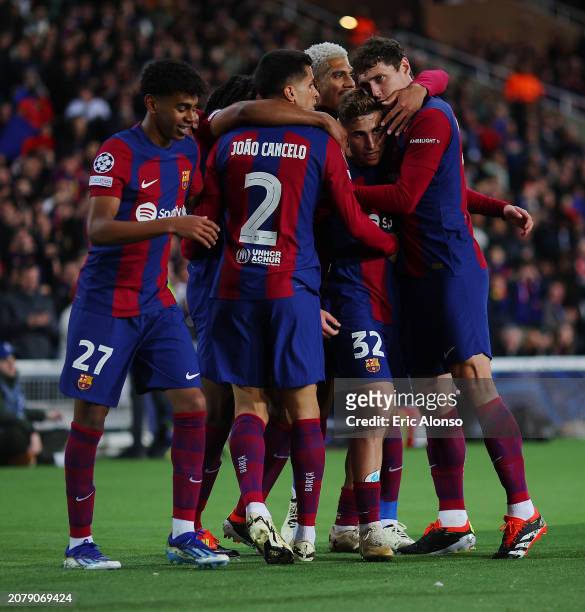Joao Cancelo of FC Barcelona celebrates with teammates after scoring his team's second goal during the UEFA Champions League 2023/24 round of 16...