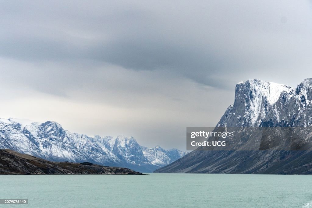 Mountains and cliffs of Archean rock framing Kangerlussuaq Fjord, Greenland