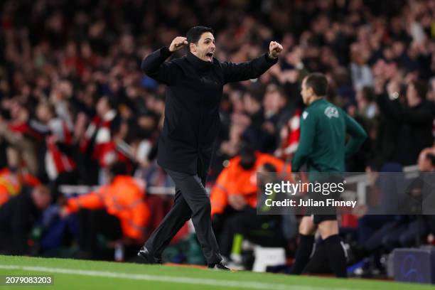 Mikel Arteta, Manager of Arsenal, celebrates after Leandro Trossard of Arsenal scores his team's first goal during the UEFA Champions League 2023/24...