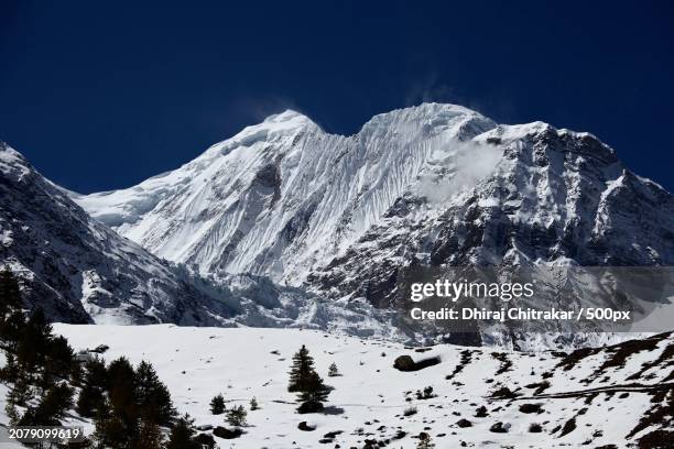 scenic view of snowcapped mountains against clear sky - thorung la pass stock pictures, royalty-free photos & images