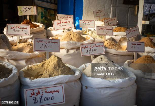 Bees feed on powdered spices at a stall within the souk in he ancient medina of Sousse, Tunisia. The medina is a UNESCO World Heritage Site.