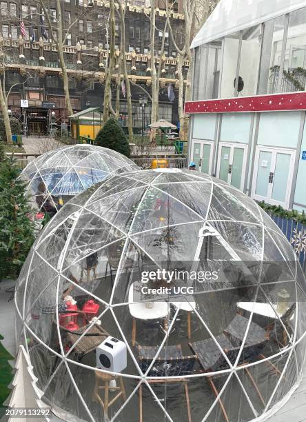 Bryant Park in New York City has Cozy Igloos, which are outdoor privately heated clear domes that seat eight people for food and drinks and can be...