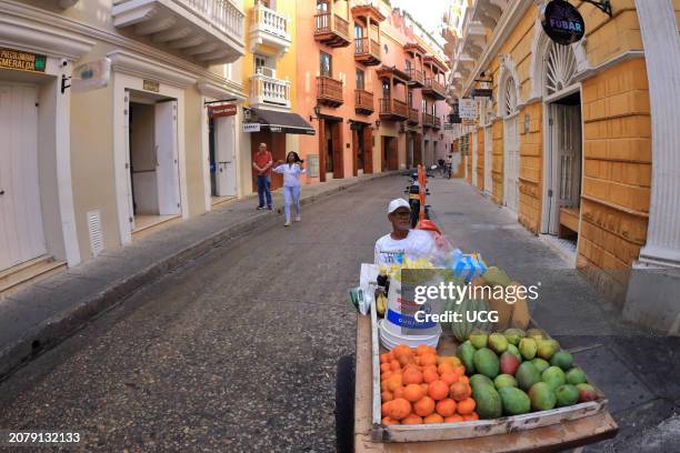 Cartagena, Colombia, A tropical fruit seller is seen in one of the streets of the historic center of Cartagena in the walled city.