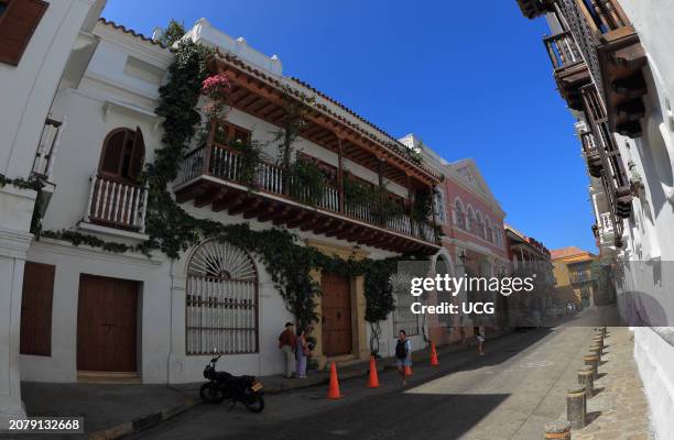 Cartagena, Colombia, Houses with balconies from the time of the Spanish conquest are seen in the street of the walled city of Cartagena.