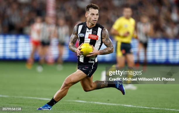 Jamie Elliott of the Magpies in action during the 2024 AFL Round 01 match between the Collingwood Magpies and the Sydney Swans at the Melbourne...
