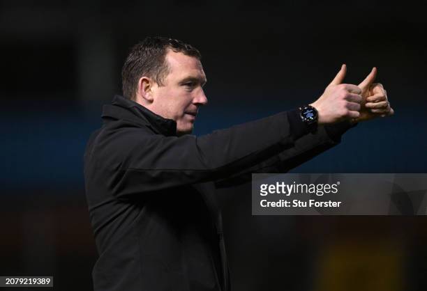 Barnsley manager Neill Collins celebrates victory after the Sky Bet League One match between Carlisle United and Barnsley at Brunton Park on March...