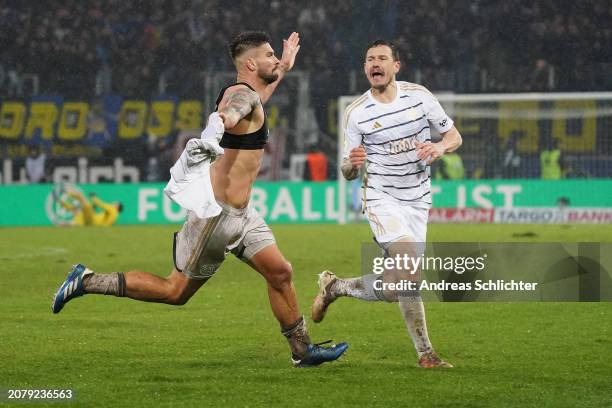 Kai Bruenker of 1. FC Saarbruecken celebrates scoring his team's second goal during the DFB cup quarterfinal match between 1. FC Saarbrücken and...