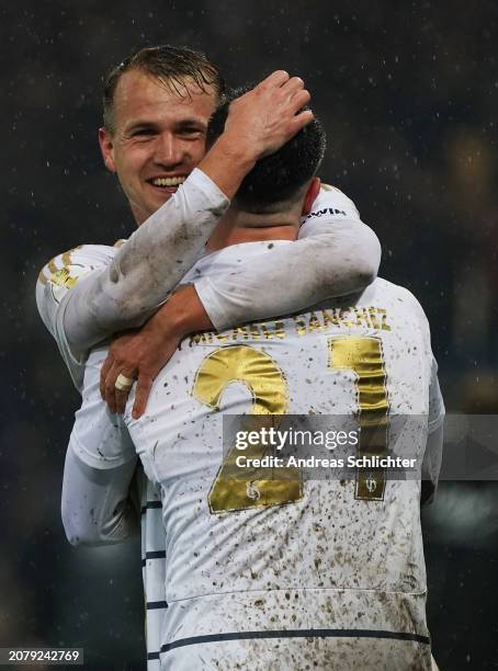 Lukas Boeder and Fabio Di Michele Sanchez of 1. FC Saarbruecken celebrate after Kai Bruenker of 1. FC Saarbruecken scores his team's second goal...