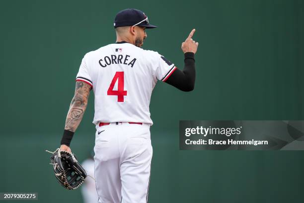 Carlos Correa of the Minnesota Twins looks on during a spring training game against the Atlanta Braves on March 4, 2024 at the Lee County Sports...